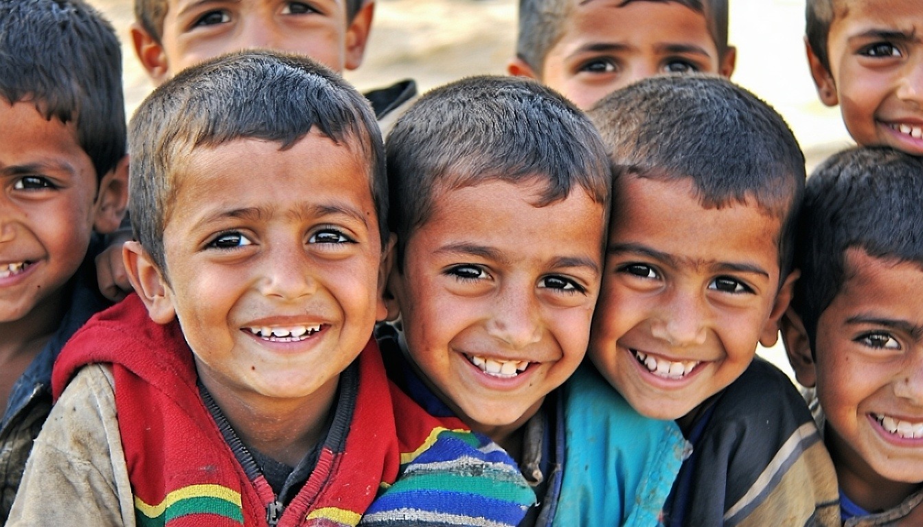 A group of happy orphans smiling at the camera in Gaza-1
